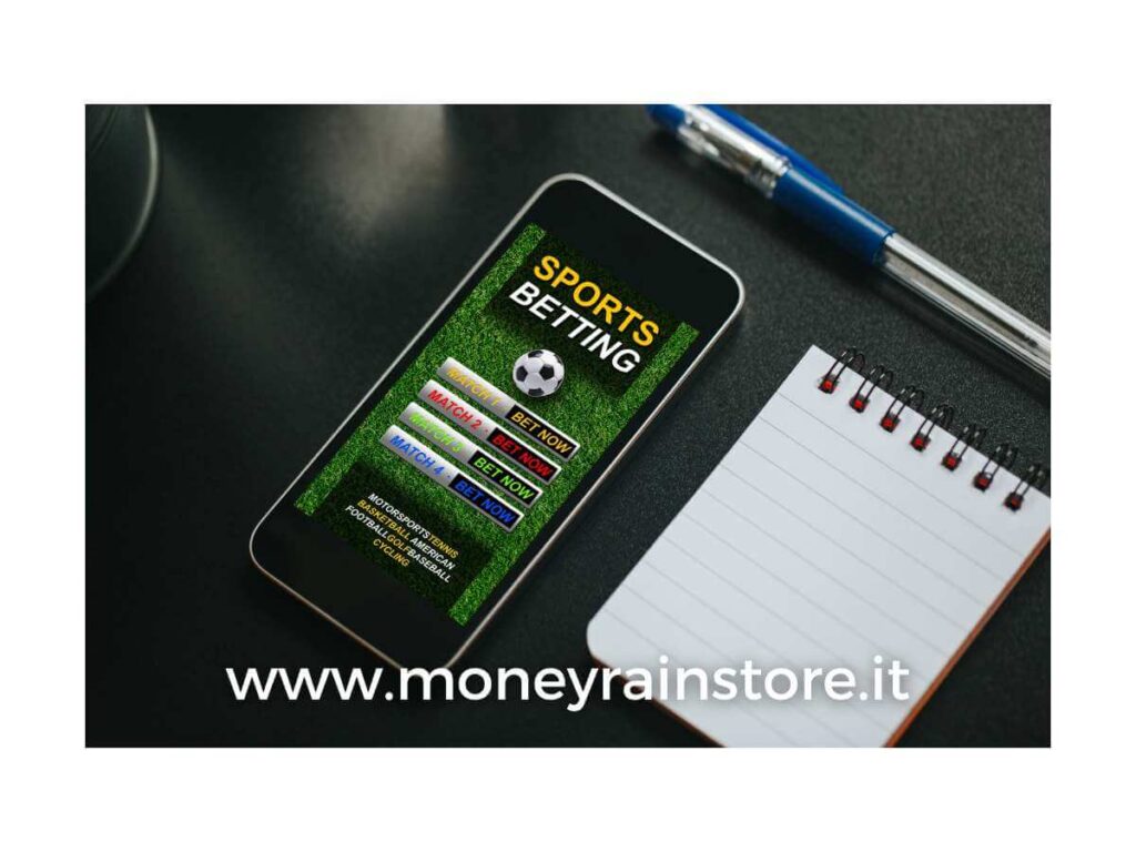 Scommesse sportive sisal; la foto mostra un telefonino con aperta una apgina web di scommesse, un block notes ed una penna